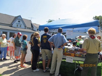 Courtesy photo. People enjoyed having a free hotdog lunch before this year's Chelsea Community Fair Parade.