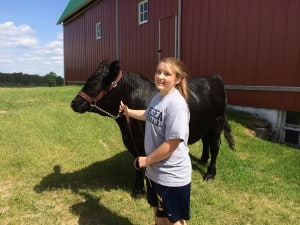 Mackenzie Schneider and Diesel at home on the family farm. 