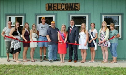 Chelsea Mayor Jason Lindauer (center), the six fair queen candidates, the fair board members and current Fair Queen Megan Kern welcome you to the 77th annual Chelsea Community Fair.