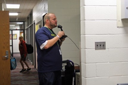 Beach Middle School Principal Nick Angel makes announcements to students.  
