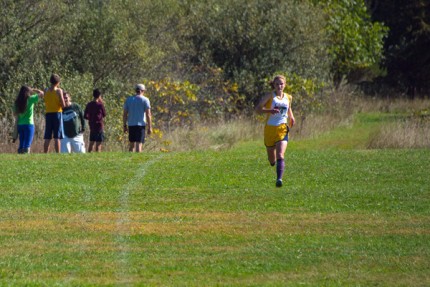 Photo by Roy Schmidt. First Chelsea girl heads to the finish line. 