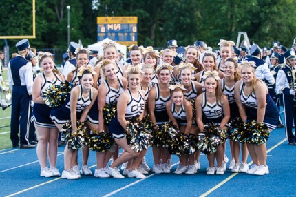 Photo by Burrill Strong. Sideline cheer squad.