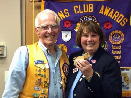 Courtesy photo. Richard Ulrick presented District Governor Vicki Lautzenheiser a wooden lion that he’d made at a recent Chelsea Lions Club meeting. 