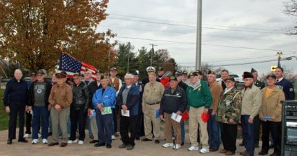 Local veterans pose for a photo following this year's Veterans Day ceremony at Veterans Park on Nov. 11.