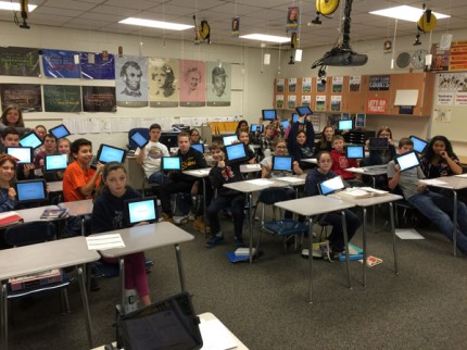 Courtesy photo. Students in one of Jason Morris’ eighth-grade history classes hold up their iPads to demonstrate the use of Nearpod, an interactive learning program.