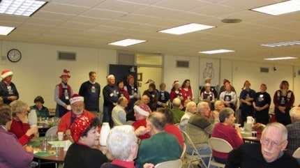 Courtesy photo. Crowds enjoy the annual Christmas feast at the Chelsea Senior Center. 