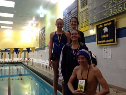 Courtesy photo of the 1st place 400 freestyle relay team. Top left is Olivia Olk, Fayth Frazier, Alexis Nelson and Wes Wickens is in front holding his "Outstanding Swimmer of the Meet" plaque. 