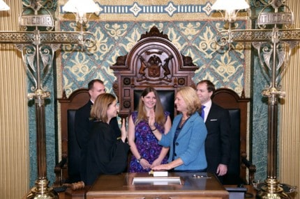 Courtesy photo. State Rep.Gretchen Driskell (D-Saline) takes the ceremonial oath of office from Michigan Supreme Court Justice Bridget Mary McCormack on Jan. 14. Joining her are her three children: Ryan, Matt and Marielle Driskell.
