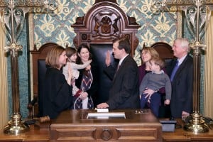 Courtesy photo: State Rep. Jeff Irwin (D-Ann Arbor) takes the ceremonial oath of office from Michigan Supreme Court Justice Bridget Mary McCormack on Jan. 14, 2015. Joining him were his spouse Kathryn Loomis, their children Sylvia and Mackinac, and his parents Cynthia Williams and former state senator Mitch Irwin.