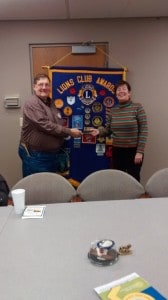 Chelsea Lion Paul Weber thanks Amy Heydlauff for talking to the Lions about the Chelsea Area Wellness Foundation.