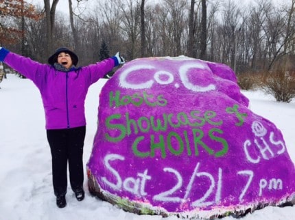 Courtesy photo. Sue Whitmarsh after she and Karen Brannon finished painting the rock on Wednesday.