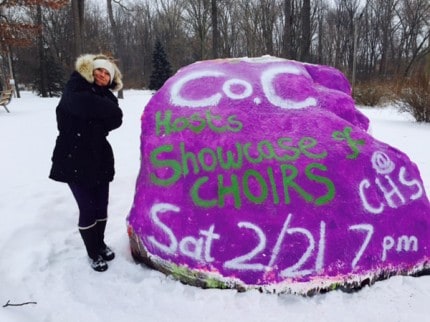 Courtesy photo. Karen Brannon after she and Sue Whitmarsh finished painting the rock on Wednesday.