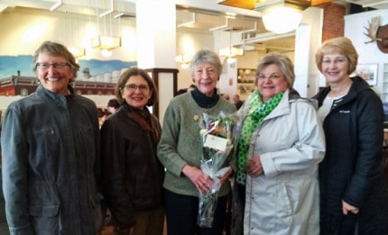 Courtesy photo. Anne Comeau (in center) was recently chosen as the Howard S. Holmes Humanitarian of the Year. She receives her award from Faith in Action President Julie Frost, director Nancy Paul, friend Jane Diesing, and FIA Board Member Cathy Crocker.
