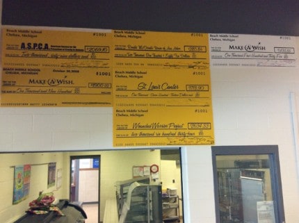 Some of the checks that Scott Eckland has designed for the Beach Middle School fundraising efforts. 