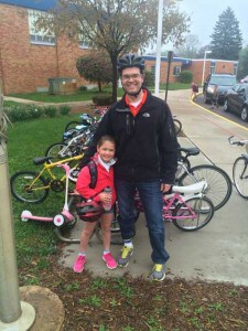 Photo by Crystal Hayduk. Photo Cook: taken by Marcus Kaemming – Mia Cook rode her bike to school accompanied by her father, Brad, on National Bike to School Day, May 6.