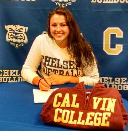 Courtesy photo. Kristen Newman signs a letter of intend to play softball at Calvin College.