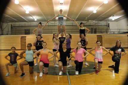 The Chelsea Cheer leading squad works on a stunt at a recent practice. 