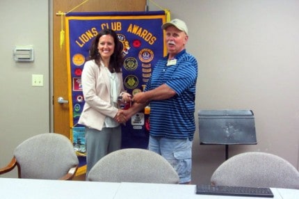 Courtesy photo. Beach Middle School leadership teacher Kathryn McCalla and Lion Member Keith Bloomensaat after she spoke about the program at a recent Lions Club meeting. The main goal of her class is to get youth involved with taking leadership roles in community service.