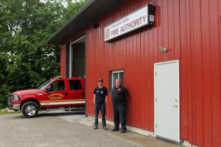 Firefighter Ian Ballard and Chelsea Fire Chief Jim Payeur outside newly operational Station 2 in Lima Township.
