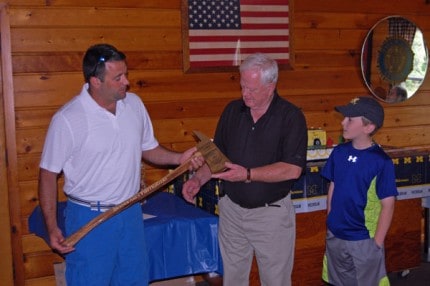 Photo by Sean Dalton, welovedexter.com. Chief Loren Yates receives a special ax during his retirement party.