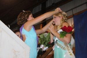 2014 Chelsea Fair Queen Amy Gilbert places the queen's crown on Alissa Trinkle's head.