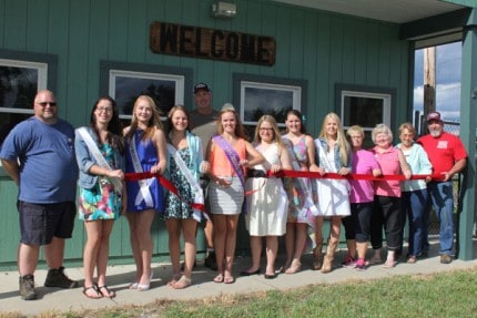 the 2015 Chelsea Community Fair is officially underway following a ribbon cutting by Amy Gilbert the 2014 Fair Queen, the six fair queen candidates and several fair board members.