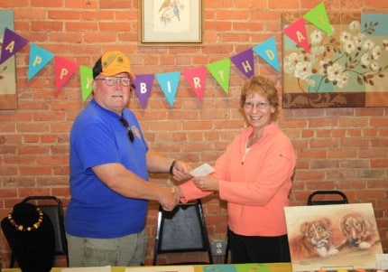 The Chelsea Lions Club made a donation to Chelsea Update. Note the staff, Buzz and Ryan, who were guarding the home office during the party, were not forgotten thanks to the lovely painting by Sue Craig. 