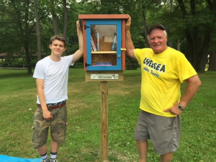 Courtesy photo. Sam Beale and Gary Muncie after installing the new Little Free Library in Pierce Park lat week. 