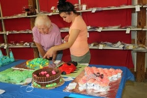 Two of the judges discuss the decoratated cakes Sunday night. 