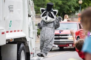 Photo by Burrill Strong. Reggie the Recycling Racoon rode in last week's Chelsea Community Fair Parade.
