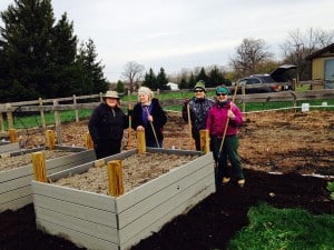 Courtesy photo by Rodger Cook .Left to right, Linda Cook, Marlene Brines, Mary Heffelfinger and Barb Rutz prepare for spring planting at the Giving Garden at St. Joseph Catholic Church in Dexter. 