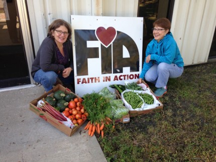 Courtesy photo. Barb Rutz of the St. Joseph Catholic Church Giving Garden delivers produce to Faith in Action Executive Director Nancy Paul. Photo provided by St. Joseph Catholic Church.