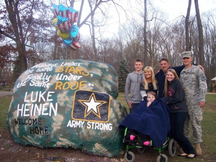 Photo by Lisa Carolin. Luke Heinen and his family at The Rock Monday afternoon.