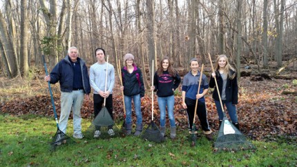 Courtesy photo of Chelsea High School Key Club (and friends) helping rake a senior's property. 