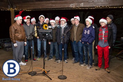 Photo by Burrill Strong. Chelsea choir sings during Hometown Holiday tree lighting ceremony.