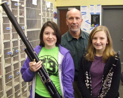 Photo by Crystal Hayduk. Middle School Band: (Front left to right) Makenna Ford and Kara Feldkamp with Middle School Band Director, Jim Otto.