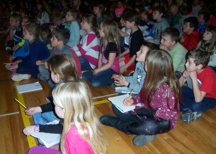 South Meadows Elementary School students listen to Ruth Barshaw McNally speak. 
