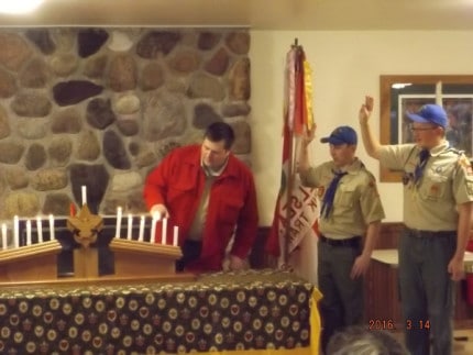 Courtesy photo. Third picture is the senior patrol leaders leading the scout law while the Scoutmaster lights the candles.