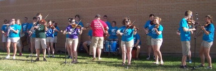 Photo by Lisa Carolin. The annual Ice Cream Social included a performance by fiddlers.