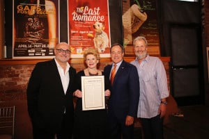 Photo by MC Creative Design and Photography. Debbie Stabenow presents a proclamation to the Purple Rose Theatre.
