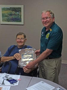 Paul Weber was preented a Melvin Jones Fellowship award by Dave Hill, district governor for Lion District 11b1.