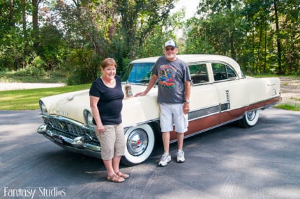 Photo by Fantasy Studios. Karen and Robert Sheppard, their Packard and the winning beer stein.