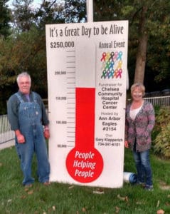 Gary and Karin Klapperich track their goal to raise $25,000 for St. Joseph Mercy Chelsea cancer services with the thermometer in use each year since 2009.