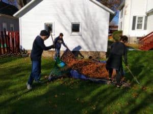 Courtesy photo. The Key Club raking leaves at a senior's home during a recent volunteer outing. 